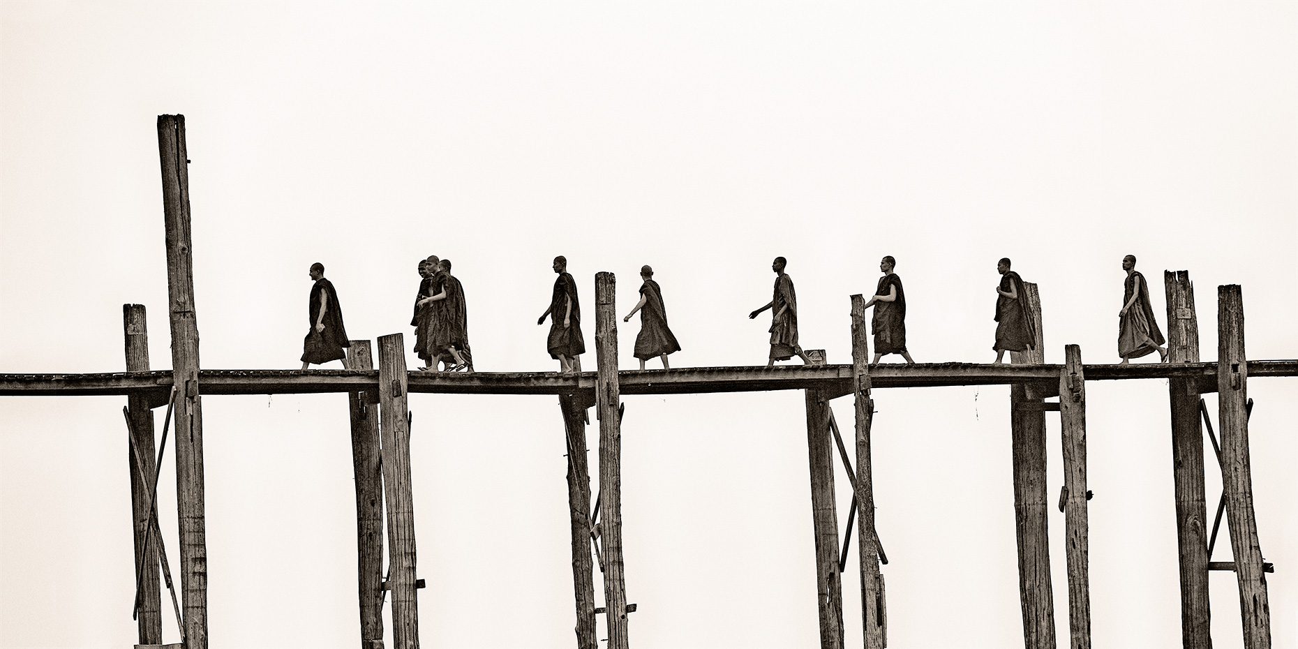 monks on u-bein bridge